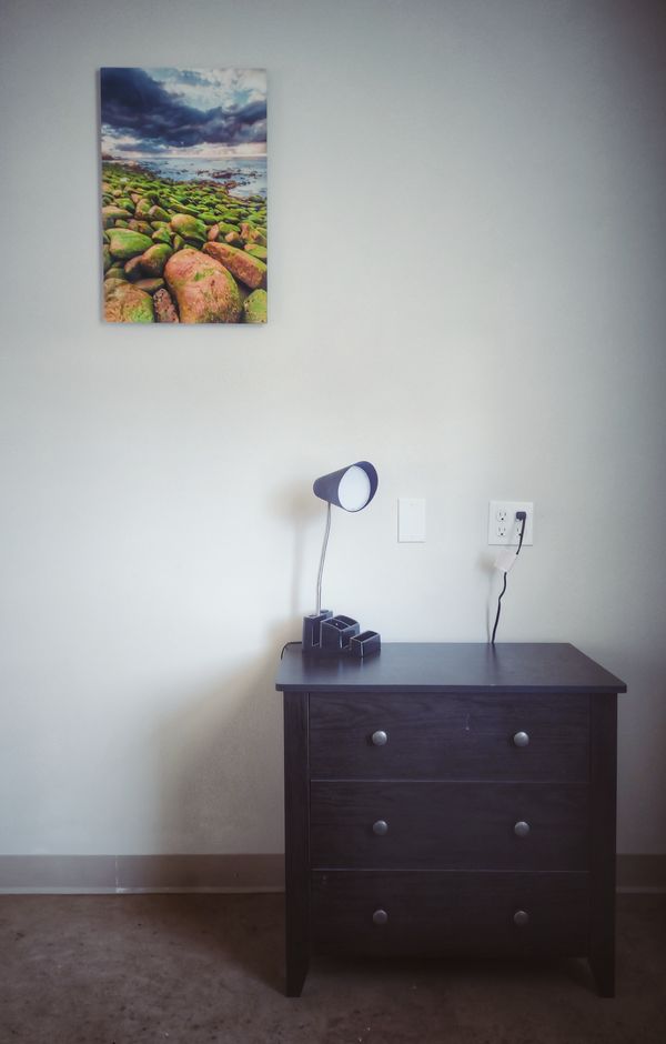 A respite room: dresser and lamp.